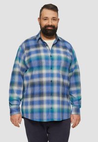 Blauw en groen geruite button-up shirt, met een kraag, lange mouwen en een relaxed fit. Gemaakt van lichtgewicht stof met een ruitpatroon.