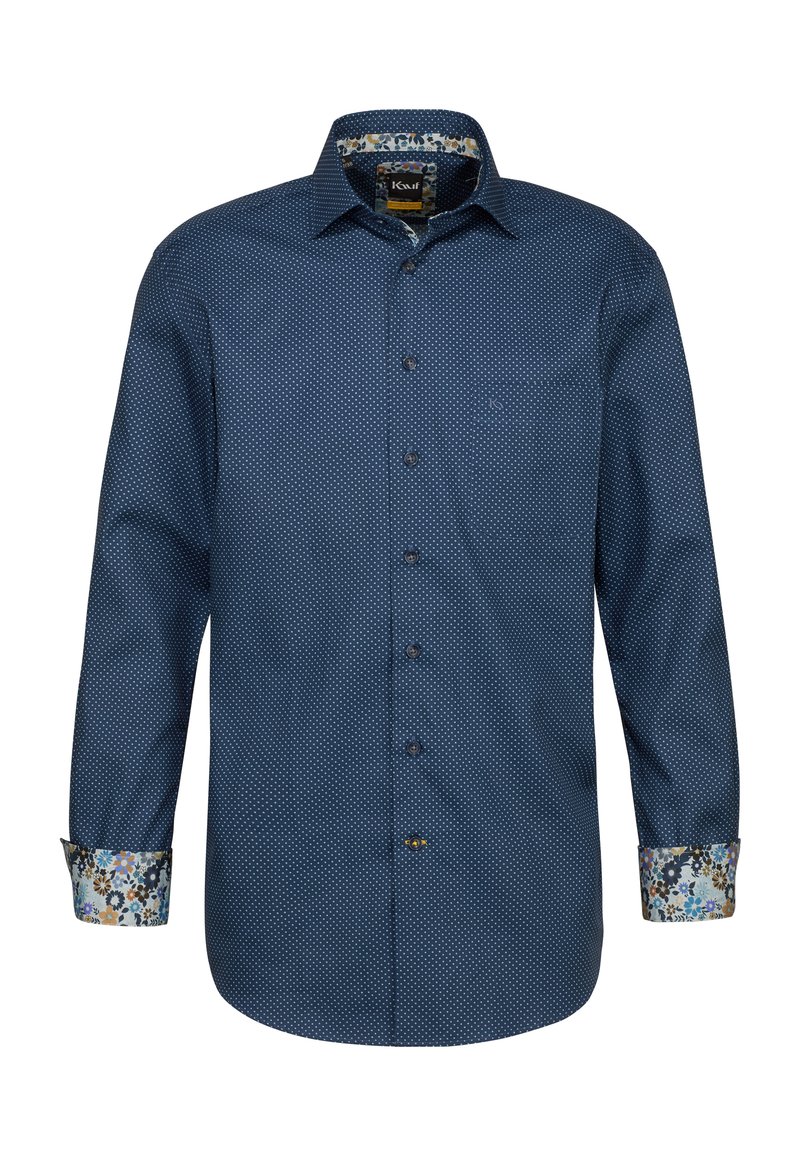 Camicia blu navy con piccoli pois bianchi, presenta un polsino e un colletto foderati con un motivo floreale. Realizzata in un tessuto testurizzato.