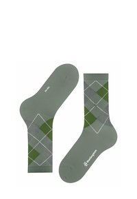 Zielone bawełniane skarpetki z wzorem argyle w ciemnozielonym i szarym kolorze, z białymi konturami diamentów i logo na podeszwie.