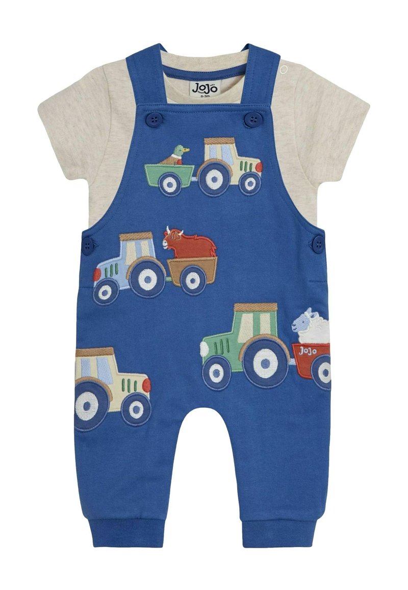 Combinaison en coton bleu avec des manches courtes grises, ornée de tracteurs et d'animaux brodés colorés. Détails de boutons sur les bretelles.