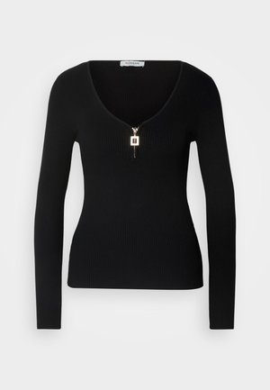 Top de manga larga negro con relieve que presenta un escote en V pronunciado y un cierre de cremallera dorada en la parte delantera, hecho de un material elástico para un ajuste ceñido.