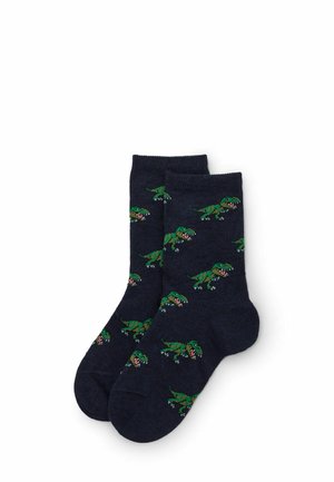 Marina strumpor med grönt dinosauriemönster. Tillverkade av ett mjukt, texturerat material. Crew-längd med förstärkt tå och häl.