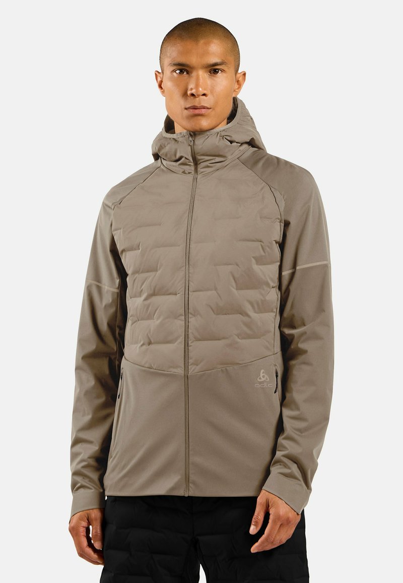 Lightweight beige jacket with textured padded front, hood, full zip closure, and side pockets. Made from a smooth, durable material.