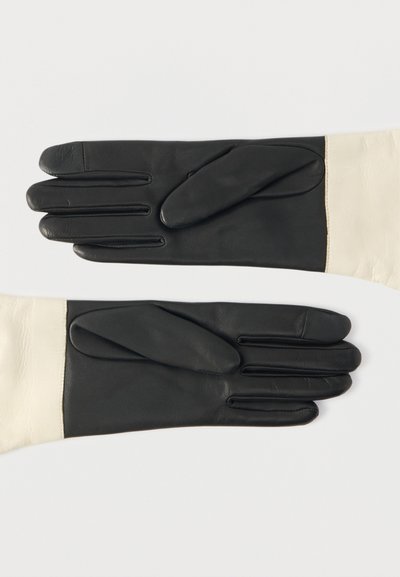 Δερμάτινα γάντια με χρωματικό συνδυασμό μαύρου και κρεμ, με λεία υφή, διακριτά τμήματα δαχτύλων και επενδυμένα μαξιλαράκια στα δάχτυλα.