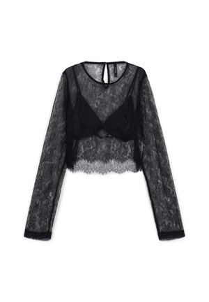 Schwarzes Spitzen-Crop-Top mit langen Ärmeln aus transparentem Stoff, aufwendigen floralen Mustern und einem Schlitz-Rückendetail. Mit welligem Saum.