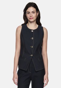 Dunkelblaue ärmellose Jeansweste mit fünf goldfarbenen Knöpfen, kontrastierenden Nähten und zwei Vorder Taschen. Taillierte Passform mit abgerundetem Ausschnitt.