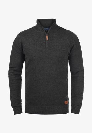 Tumehall подсвеженный свитер pehmeast kudumisest. Omab ribakrae ja hem ja nahast logo plaati alumisel vasakul küljel.