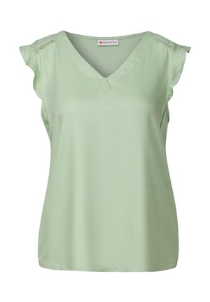Top senza maniche di colore verde chiaro realizzato in tessuto morbido. Presenta un colletto a V e decorazioni con ricami a giorno sulle cuciture delle spalle.