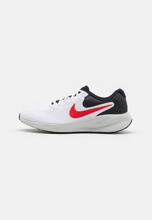 Chaussure de running blanche et noire avec logo swoosh rouge et lacets blancs vue de profil sur un fond uni.