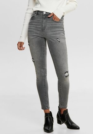 Vaqueros pitillo - used denim