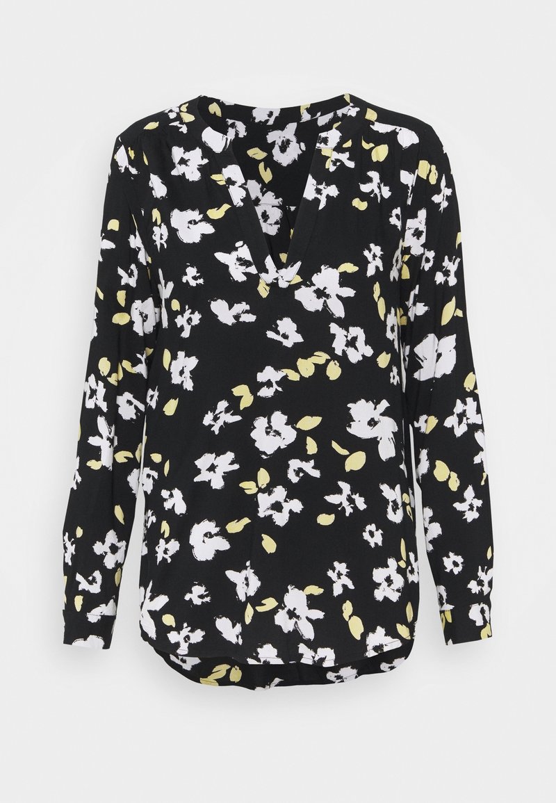 Blouse noire à manches longues avec imprimé floral abstrait blanc et jaune pâle et un décolleté en V discret.