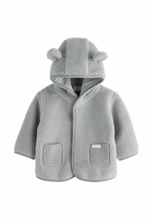 Veste en polaire grise avec capuche ornée d'oreilles d'ours, poches à rabat et texture douce. Bords finement travaillés dans un matériau contrastant.
