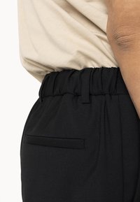 Drudd Italia D-GOLDES - Trousers - black