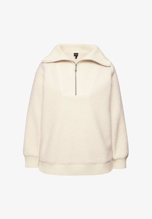 Kremowy polarowy sweter z pół zamkiem i ściągaczem przy dekolcie. Posiada kwadratowy dekolt i obniżone ramiona, a także ściągacze przy mankietach i u dołu.