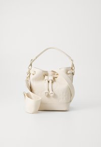 Cream bucket bag with embossed floral design, a top handle, and a detachable shoulder strap. Features gold-tone hardware and drawstring closure.