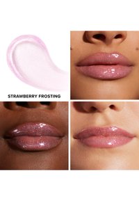 Glanzende lipproduct in een lichtroze tint, gelabeld "Aardbeientaart." Heeft een doorschijnende glans en wordt aangebracht op verschillende huidskleuren.