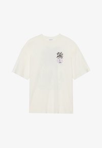 Camiseta de algodón blanca con mangas cortas, que presenta un gráfico de una palmera y la palabra "ALPHA" en púrpura en el área del pecho izquierdo.