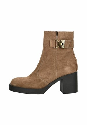 Brown suede ankle boot with a rounded toe, a chunky black heel, and a side zipper. Features a decorative buckle strap detail.