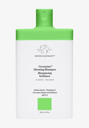 White bottle with a green cap, featuring a minimalist design. Labels in black convey product name and ingredients. 240 ml capacity.