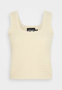 Top de malha creme com decote quadrado, bordas onduladas e acabamento texturizado. O rótulo lê "PIECES" por dentro.