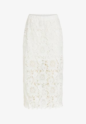 Fehér, virágmintás csipkemidi szoknya, masszív béléssel, amely a térd fölött ér véget, és áttetsző csipkével, amely a vádli közepéig ér.