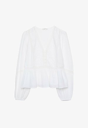 Blouse blanche avec un décolleté en V profond, des manches bouffantes longues et un ourlet péplum froncé. Des détails brodés et des boutons complètent le design.
