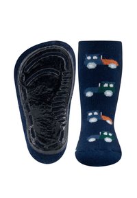 Granatowe skarpetki z wzorem traktorów w kolorach zielonym, pomarańczowym i białym; teksturowana czarna gumowa podeszwa dla lepszej przyczepności; długość do połowy łydki.