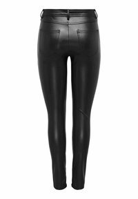 Leggings de imitación piel negras con un diseño ajustado, que cuentan con dos bolsillos traseros y una textura suave. Cremallera en el tobillo para un detalle adicional.