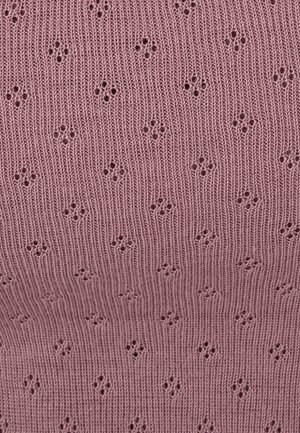 Textured knit fabric in soft pink color featuring a pattern of small eyelet designs throughout, enhancing its visual appeal.