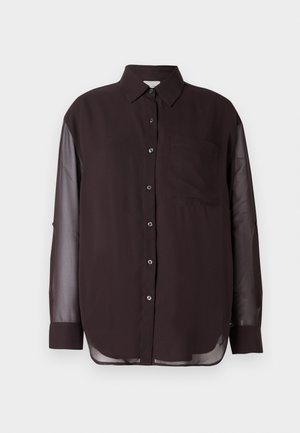 Cămașă neagră cu nasturi, cu mâneci lungi transparente, un buzunar pe piept și un tiv rotunjit. Textură de material neted; design clasic al gulerului.