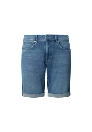 Keskmise sinise värvi denimpüksid, millel on keeratud servad, lukuga hõlbustus, viis taskut ning esiküljel peened hõõrdumiste jäljed.