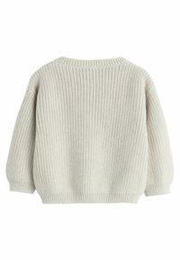 Gaišbeigā adīta džemperis ar brīvu piegriezumu, apaļu kakla izgriezumu un ribota piedurkņu apdari. Ar teksturētu rakstu visā virsmā, kas izceļ relaksētu dizainu.