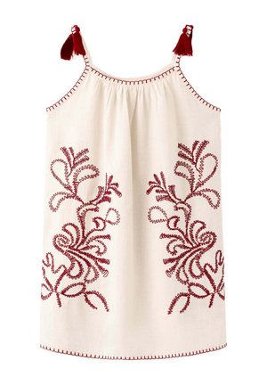 Vestito bianco senza maniche con motivi floreali ricamati rossi e nappine rosse sulle spalline.