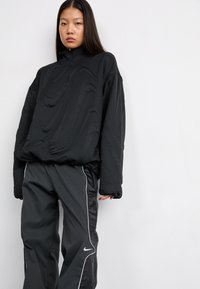 Nike Sportswear Treniņtērpa apakšdaļas - black