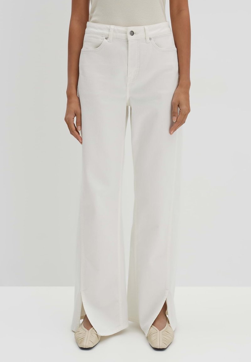 White wide-leg jeans made of denim, featuring a high waist, front pockets, and side slits at the hem for added detail.
