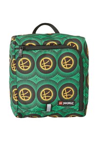Lego Ninjago backpack featuring a green fabric with black and yellow circular patterns, zippered front pocket, and sturdy black handle.