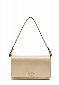 Kuldse nahast risti kehavööga kott, sileda tekstuuriga, reguleeritava rihmaga ja esiküljel reljeefne brändilogo. Ristkülikukujuline.