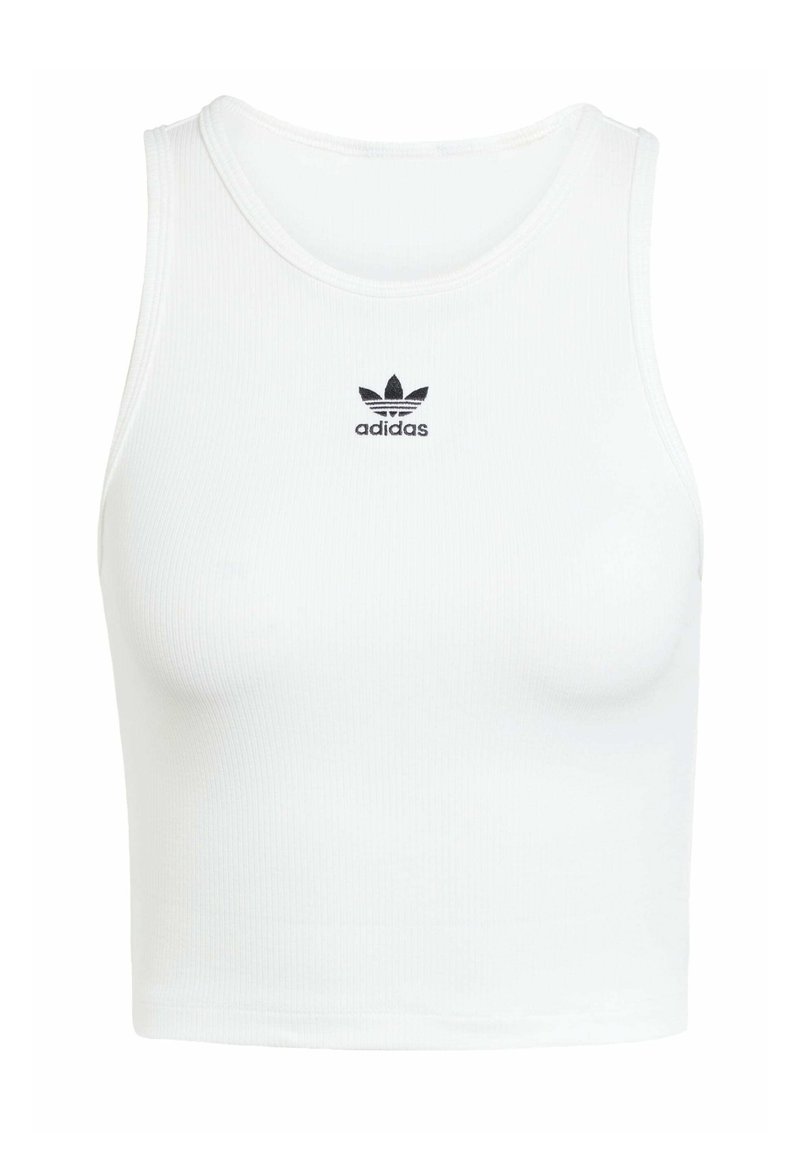 Vit bomullstopp med en figurnära ribbad struktur, rund halsringning och svart broderad Adidas-logotyp framtill.