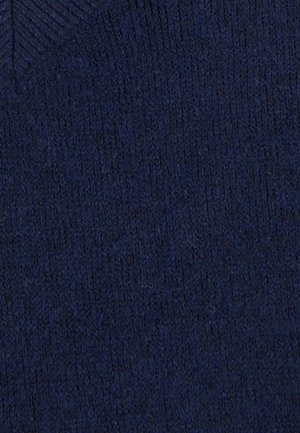 Tissu texturé bleu marine avec une apparence tricotée douce. Présente un motif subtil en haut, mettant en avant un matériau confortable et chaud.