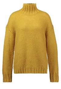 Pull en maille épaisse jaune moutarde avec un col montant et des épaules tombantes. Manches et ourlet côtelés. Tissu texturé, coupe décontractée.