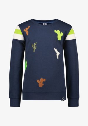 Sweat-shirt à manches longues bleu marine avec des rayures blanches et vert néon sur les épaules et des patchs cactus multicolores sur le devant.