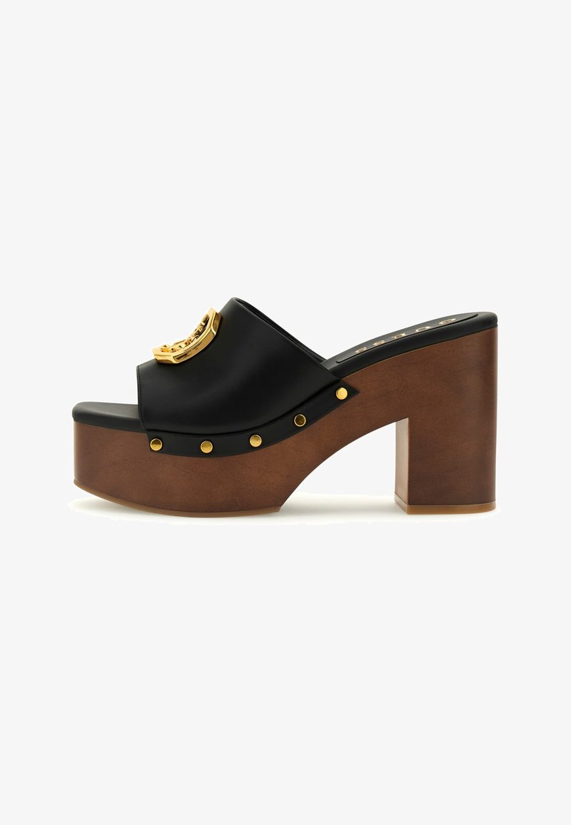 Black platform slide with a glossy finish, gold hardware accent, wooden block heel, and decorative gold studs along the upper edge.