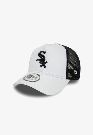 White baseball cap with a black mesh back, featuring a black embroidered logo on the front and a circular adjustable tag on the brim.