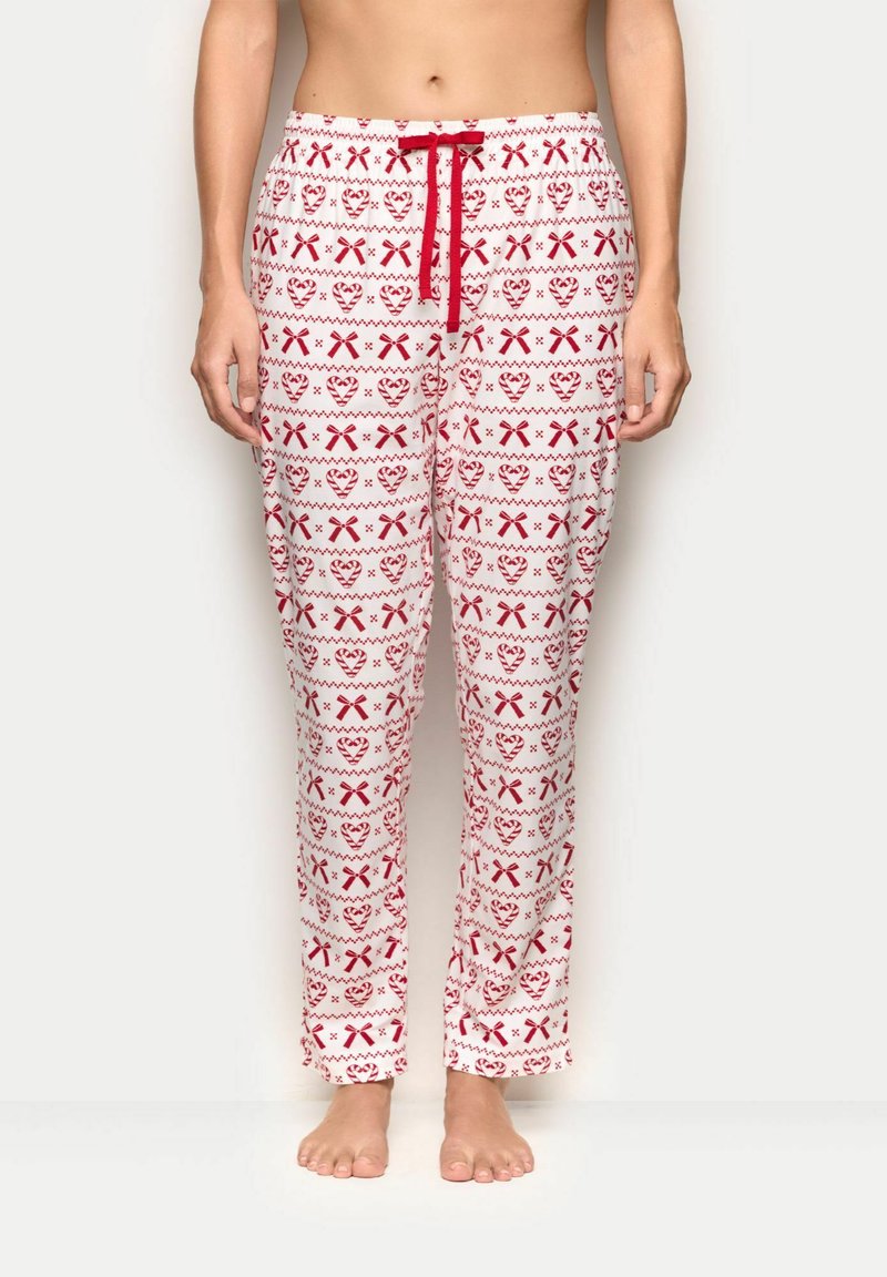 Bílé pyžamové kalhoty s červenými srdíčky a vzorem stužek; mají elastický pas s červeným šňůrkovým stahováním; volný, pohodlný střih.