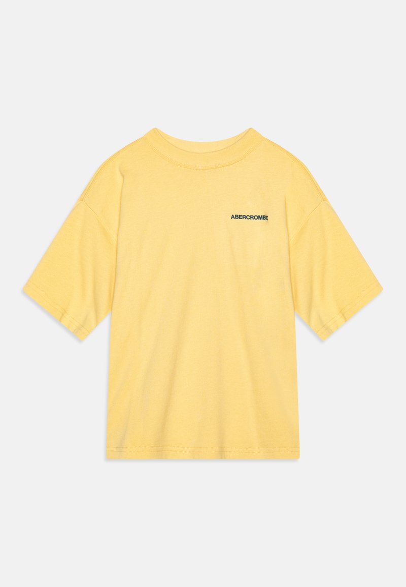 Yellow cotton t-shirt with a relaxed fit, short sleeves, and a black logo on the left chest area. Soft texture, classic crewneck design.