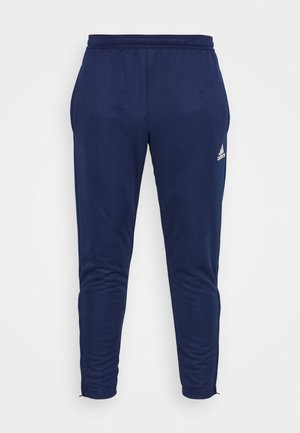 Pantaloni sportivi blu navy realizzati in materiale morbido, caratterizzati da un design affusolato, una vita elastica e un discreto logo bianco.