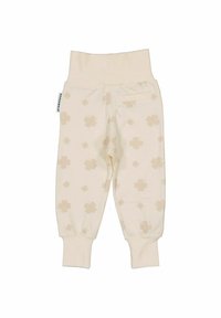 Ljusbeige bomullsbyxor med mjukt elastiskt midjeband, avslutningar som smalnar av och ett subtilt blommönster i en ljusare nyans.