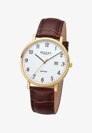 Montre ronde dorée avec un cadran blanc, des chiffres noirs et un indicateur de date. Bracelet en cuir marron à motif crocodile, mouvement à quartz.