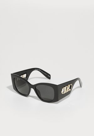 Black rectangular sunglasses with dark lenses. Features a glossy finish and gold hardware accent on the side displaying the brand logo.