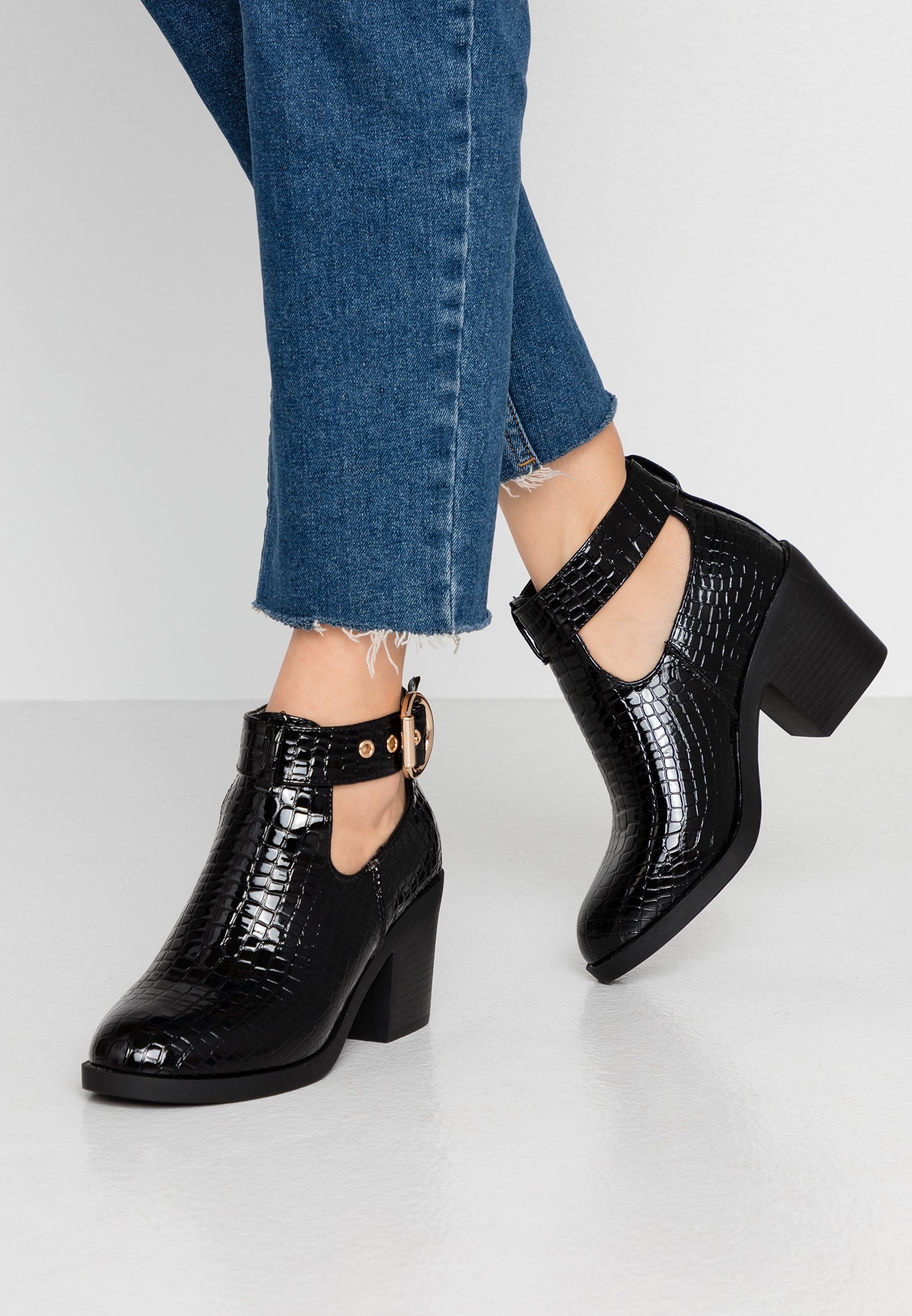 black buckle ankle boots uk